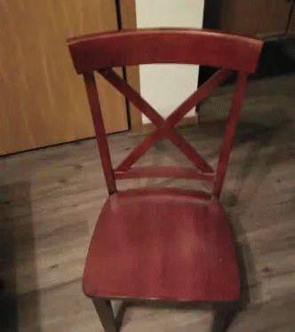 purple wooden chair sitting on the floor