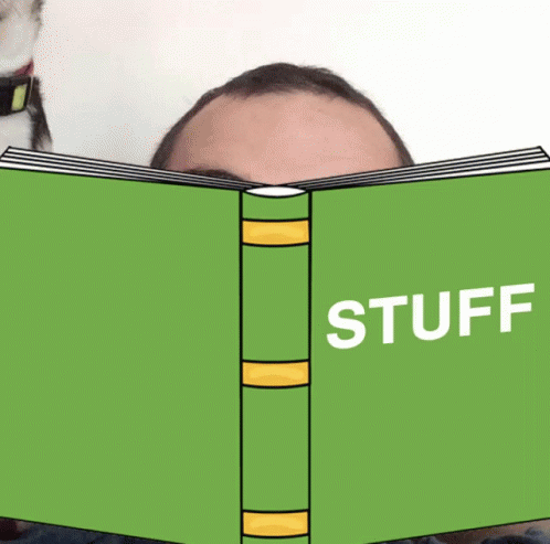 an open green book with the word stuff written on it