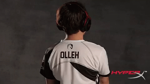 a boy standing up wearing a shirt that says olleh