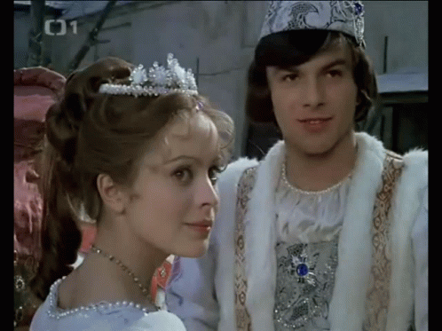 a man and a woman dressed in princess outfits