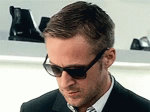 a man in sunglasses and a black suit