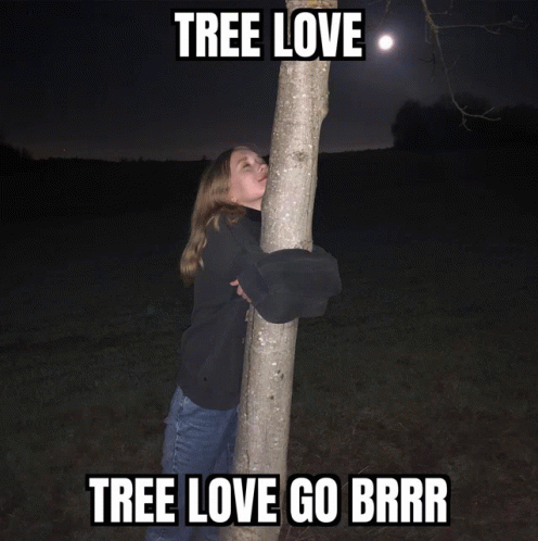 a woman is standing on the side of a tree with words that say, tree love go brrr
