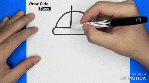 a person drawing with their hands on a piece of paper