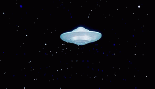 a glowing white object with stars on the night sky