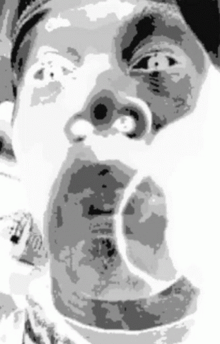 a black and white po of a person making a face