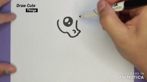 two people draw lines in an notebook with a small black marker