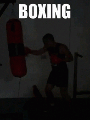man doing exercises for boxing with punching bag
