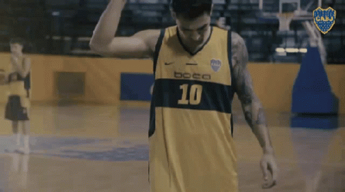 a basketball player is raising his right hand in celetion
