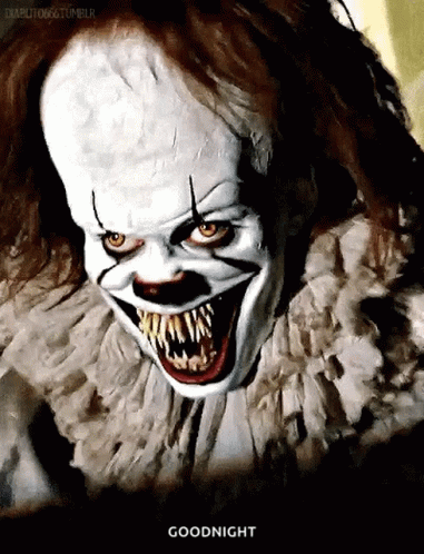 a scary clown with teeth is walking through a room