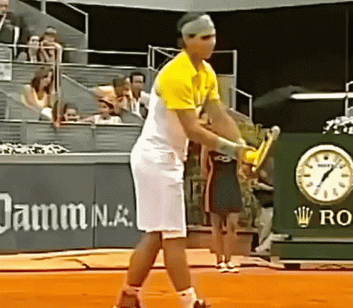 male tennis player on court about to serve