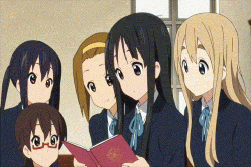 four anime characters with blue hair looking at a book