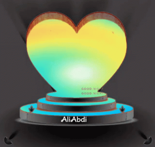heart - shaped object on pedestal with black background