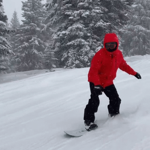 a person is skiing down a slope in the snow