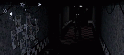 a hallway with a checkered floor and star decorations
