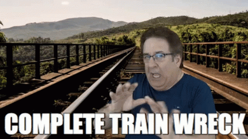 a man is making a funny face in the middle of a rail road