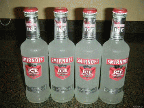 three bottles of smirnoff ice sitting on a counter top