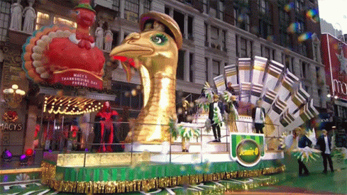the float features large snakes, some of them wearing hats and costumes