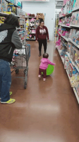 two people with children in the grocery aisle