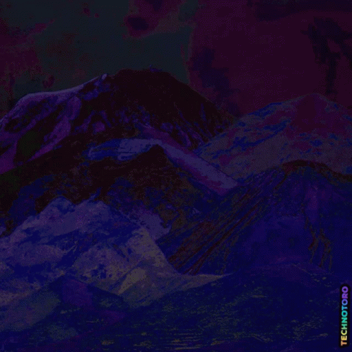 a red mountain and dark sky with words below it