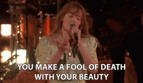 a girl is singing in front of a microphone and the words you make a fool of death with your beauty on it