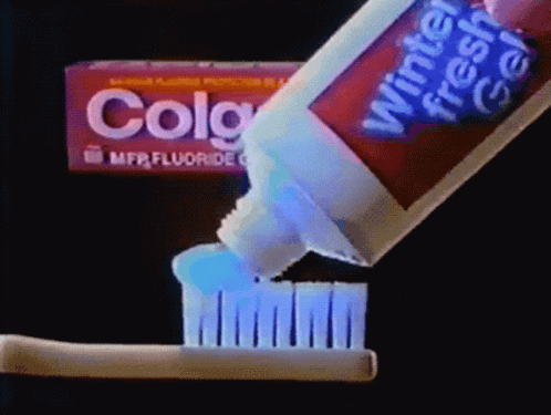 the toothpaste has been being held by a toothbrush