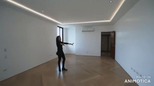 a person is walking inside an empty building