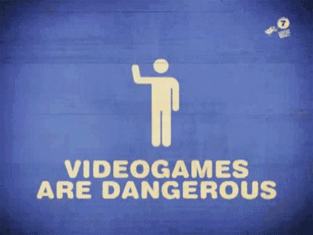 a white and orange sign on a red wall saying videos are dangerous