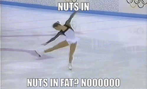 a woman skating on the ice saying nuts in the ice