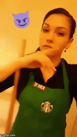 a woman in an apron that is using a cell phone