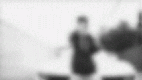 blurry po of a person wearing black shirt and legging
