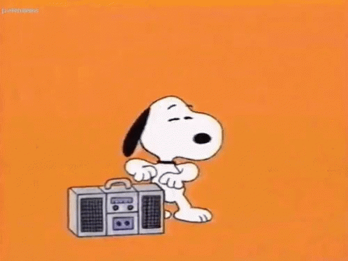 snoopy holding an amp with the sound of his radio