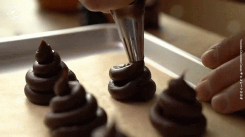 the chocolate cupcakes are being prepared for dessert consumption