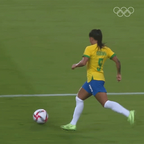 an asian female soccer player in action on the field