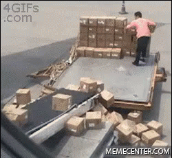 a man working on boxes in a warehouse