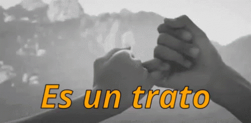 two people hold each other's hands in front of the words esun trato