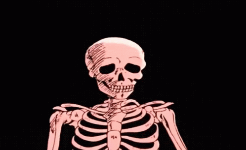 the skeleton is sitting down in the dark