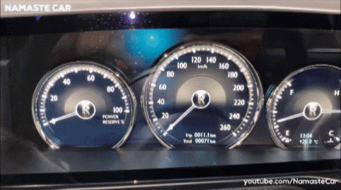 two cars instrument dashboards with several different gauges