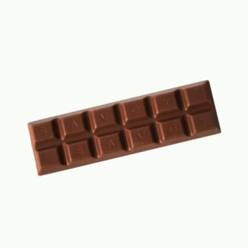 blue chocolate moulder with four pieces of white chocolate