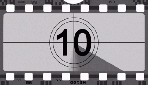 a camera lens is in front of a film strip