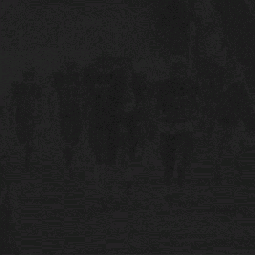a group of people walking along side each other