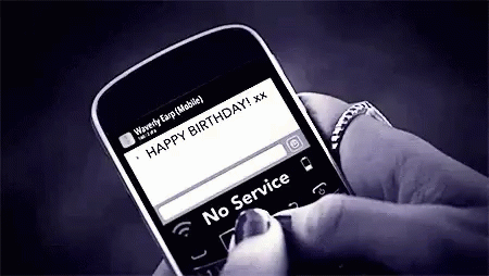 a person is checking their birthday message on their cell phone