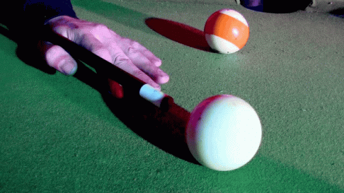 an odd ball that is being hit by another