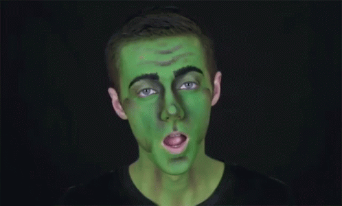 a man with green makeup on his face