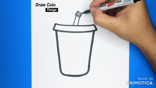 someone is drawing a cup with a white marker