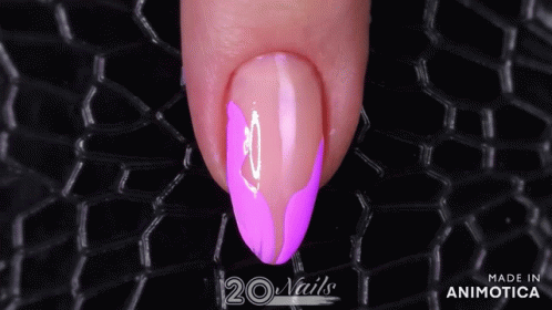 a purple manicure with pink accents on a black mesh
