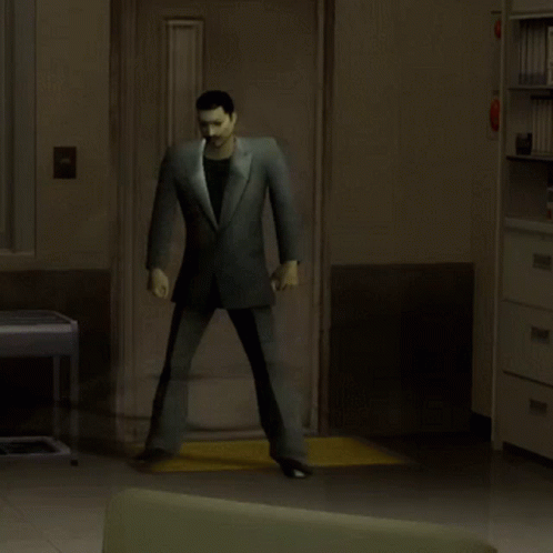 the man in the suit is walking through the room
