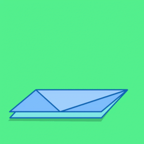 an envelope is laying down on a green background