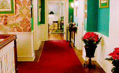 a blue hallway with purple and green walls