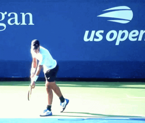 a woman is playing tennis on the court