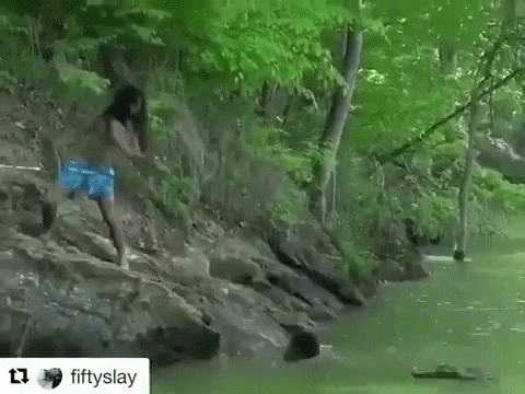 man jumps in river while girl takes him to rest